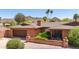Charming single-story brick home with a well-kept front yard and attached two-car garage at 3131 E Las Rocas Dr, Phoenix, AZ 85028