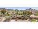 Attractive single-story brick home with a well-maintained front yard and mature desert landscaping at 3131 E Las Rocas Dr, Phoenix, AZ 85028
