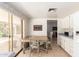 Eat-in kitchen with vintage wallpaper, table, and a view to the patio at 3131 E Las Rocas Dr, Phoenix, AZ 85028