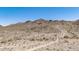Scenic desert landscape showcasing mountains, hiking trails, and sparse vegetation under a bright blue sky at 3131 E Las Rocas Dr, Phoenix, AZ 85028