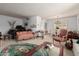 Cozy living room showing piano, sofa and dining area at 3131 E Las Rocas Dr, Phoenix, AZ 85028