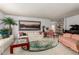 Bright living room featuring a white sofa, area rug, and ample seating at 3131 E Las Rocas Dr, Phoenix, AZ 85028
