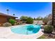 Inviting backyard pool surrounded by lush landscaping, offering a serene outdoor retreat at 3131 E Las Rocas Dr, Phoenix, AZ 85028
