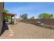 Spacious backyard featuring low-maintenance landscaping and a covered patio at 32901 N Hidden Canyon Dr, San Tan Valley, AZ 85144
