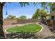Lush backyard with desert landscaping and comfortable patio seating area at 32901 N Hidden Canyon Dr, San Tan Valley, AZ 85144