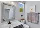 Bright bathroom featuring a vanity, toilet, and decorative mirror at 32901 N Hidden Canyon Dr, San Tan Valley, AZ 85144