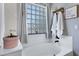 Bright bath with soaking tub and glass block window allowing natural light at 32901 N Hidden Canyon Dr, San Tan Valley, AZ 85144