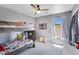 Bright bedroom with a bunk bed, plenty of light, and space to play at 32901 N Hidden Canyon Dr, San Tan Valley, AZ 85144