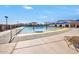 Inviting community pool area with splash features, sunshades, and lounge chairs at 32901 N Hidden Canyon Dr, San Tan Valley, AZ 85144
