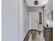 Clean entryway featuring wood flooring and a modern decorative table at 32901 N Hidden Canyon Dr, San Tan Valley, AZ 85144