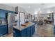 Spacious kitchen showcasing navy cabinets, center island, and open floor plan to dining area at 32901 N Hidden Canyon Dr, San Tan Valley, AZ 85144