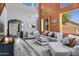 Stylish living room showcasing high ceilings, natural light, and modern decor elements at 32901 N Hidden Canyon Dr, San Tan Valley, AZ 85144