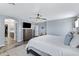 Large primary bedroom with en suite bath and views into other rooms of the house at 32901 N Hidden Canyon Dr, San Tan Valley, AZ 85144