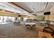 Spacious meeting room featuring neutral decor, multiple tables and chairs, and large windows for ample natural light at 32901 N Hidden Canyon Dr, San Tan Valley, AZ 85144