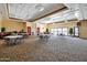 Bright meeting room featuring contemporary lighting, round tables with chairs, and sliding doors to an outdoor space at 32901 N Hidden Canyon Dr, San Tan Valley, AZ 85144