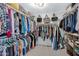 Spacious walk-in closet providing ample storage with racks and shelving at 32901 N Hidden Canyon Dr, San Tan Valley, AZ 85144