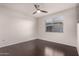Bedroom with hardwood floors, a ceiling fan, and a large window at 3302 N 7Th St # 344, Phoenix, AZ 85014
