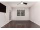 This is a bedroom that has a ceiling fan, large window, and wood floors at 3302 N 7Th St # 344, Phoenix, AZ 85014