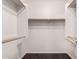 Walk-in closet with wood floors and custom shelving and clothes racks at 3302 N 7Th St # 344, Phoenix, AZ 85014