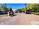 Gated community entrance with paved brick and a black SUV parked on the right at 3302 N 7Th St # 344, Phoenix, AZ 85014
