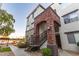Low-angle exterior showcasing the building's architectural details and staircase entryways at 3302 N 7Th St # 344, Phoenix, AZ 85014