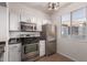 Well-equipped kitchen with stainless steel appliances and ample cabinet space at 3302 N 7Th St # 344, Phoenix, AZ 85014
