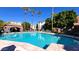 Community pool surrounded by lush landscaping at 3302 N 7Th St # 344, Phoenix, AZ 85014