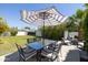 Outdoor dining space with a shaded table and chairs, perfect for alfresco meals at 338 W Encanto Blvd, Phoenix, AZ 85003