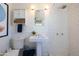 Traditional white bathroom with subway tile, pedestal sink, and shower at 338 W Encanto Blvd, Phoenix, AZ 85003