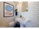 Traditional white bathroom with subway tile and pedestal sink at 338 W Encanto Blvd, Phoenix, AZ 85003