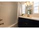 Bright bathroom showcasing a tiled shower/tub, modern fixtures, and ample lighting at 338 W Encanto Blvd, Phoenix, AZ 85003