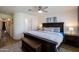 Comfortable bedroom featuring a bed, a ceiling fan, and access to an ensuite bathroom at 338 W Encanto Blvd, Phoenix, AZ 85003