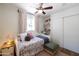 Charming bedroom with a daybed, colorful accents, and built-in shelving at 338 W Encanto Blvd, Phoenix, AZ 85003