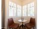 Cozy breakfast nook with natural light, featuring modern chairs and shutters at 338 W Encanto Blvd, Phoenix, AZ 85003