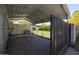 Large carport providing ample covered parking and storage space with views of the backyard at 338 W Encanto Blvd, Phoenix, AZ 85003