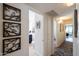 Hallway leading to a modern bathroom, complete with decorative artwork at 338 W Encanto Blvd, Phoenix, AZ 85003
