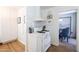 Bright kitchen featuring white cabinets and a classic white gas range stove at 338 W Encanto Blvd, Phoenix, AZ 85003