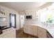 Well-lit kitchen with modern appliances, white cabinets and subway tile backsplash at 338 W Encanto Blvd, Phoenix, AZ 85003