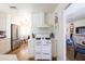 Bright kitchen featuring white cabinets, stainless steel appliances, and a vintage stove at 338 W Encanto Blvd, Phoenix, AZ 85003