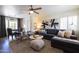 Open-concept living room flowing into dining area, featuring stylish furniture and decor at 338 W Encanto Blvd, Phoenix, AZ 85003