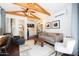 Cozy living room featuring vaulted beam ceiling, mini-bar, and comfortable seating at 338 W Encanto Blvd, Phoenix, AZ 85003