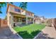 Large backyard with artificial turf, covered patio, barbecue grill, and desert landscaping at 3788 E Sexton St, Gilbert, AZ 85295