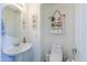 Cozy half bath with pedestal sink and toilet at 3788 E Sexton St, Gilbert, AZ 85295