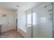 Bathroom with separate tub and shower, tiled floor, and glass block window providing natural light at 3788 E Sexton St, Gilbert, AZ 85295