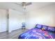 A comfortable bedroom has wood-look floors, a ceiling fan and closet at 3788 E Sexton St, Gilbert, AZ 85295