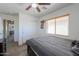 Bedroom featuring a ceiling fan, closet, and a large window at 3788 E Sexton St, Gilbert, AZ 85295