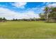 A community park features a large open grassy area, shade structures, and amenities for families and recreational activities at 3788 E Sexton St, Gilbert, AZ 85295