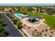 An aerial view of the community pool and playground, with picnic areas and landscaping at 3788 E Sexton St, Gilbert, AZ 85295