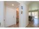 Hallway featuring door to bathroom and view into living room at 3788 E Sexton St, Gilbert, AZ 85295
