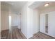Upstairs hallway with wood-look floors and a linen closet at 3788 E Sexton St, Gilbert, AZ 85295